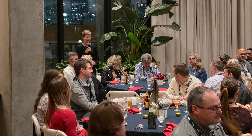 New president Dale Coates welcomes members to Dallas.